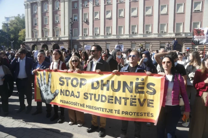 University professors and students march in Tirana, Albania, carrying a banner reading “Stop Violence Against Students” in support of the ongoing student protests. 20 October 2026.